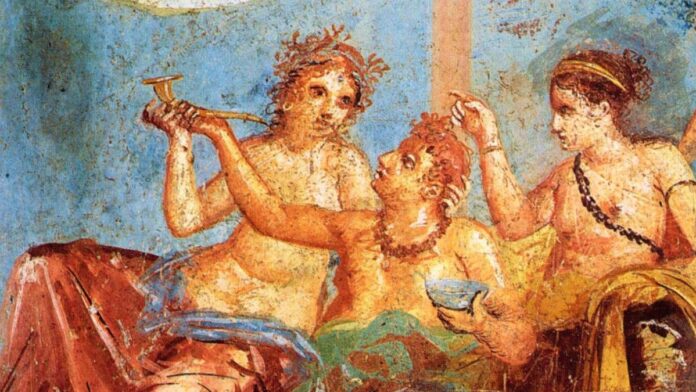 Una comida en la antigua Roma, representada en un fresco.