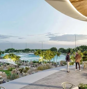 La playa de Alovera tiene un duro rival: una laguna con olas para surfear junto al estadio del Atlético de Madrid Junto al Metropolitano quieren que, surfeando, se acerquen medio millón de personas al año a esta nueva superficie de ocio.