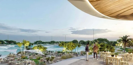 La playa de Alovera tiene un duro rival: una laguna con olas para surfear junto al estadio del Atlético de Madrid Junto al Metropolitano quieren que, surfeando, se acerquen medio millón de personas al año a esta nueva superficie de ocio.